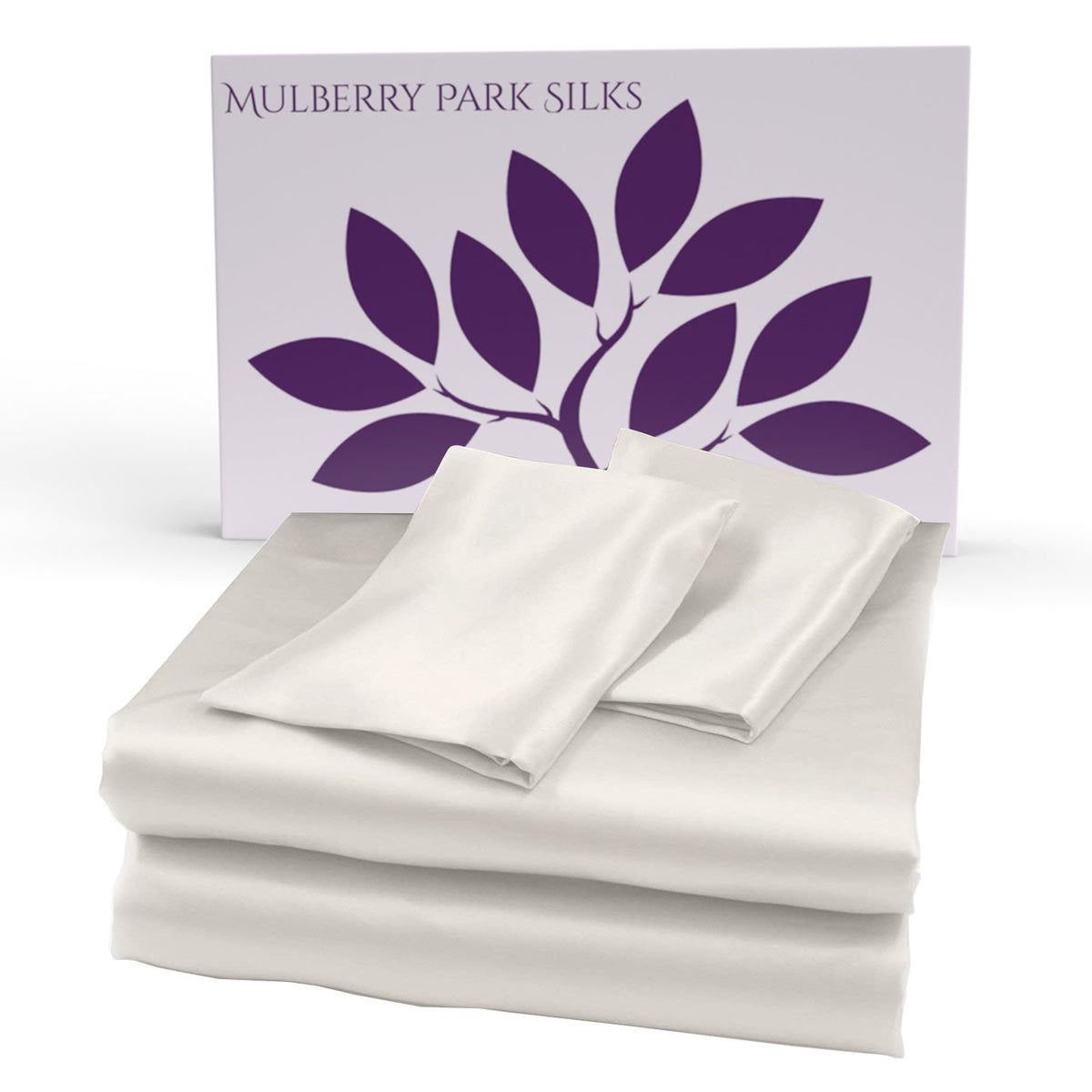 Ivory silk sheet set displayed in front of a Mulberry Park Silks box with a purple leaf logo