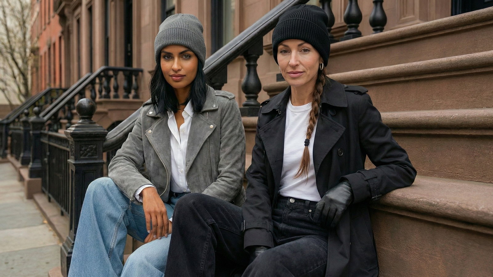 Models wearing cashmere and wool silk-lined beanies in an editorial style on the stoop of a new york city brownstone.