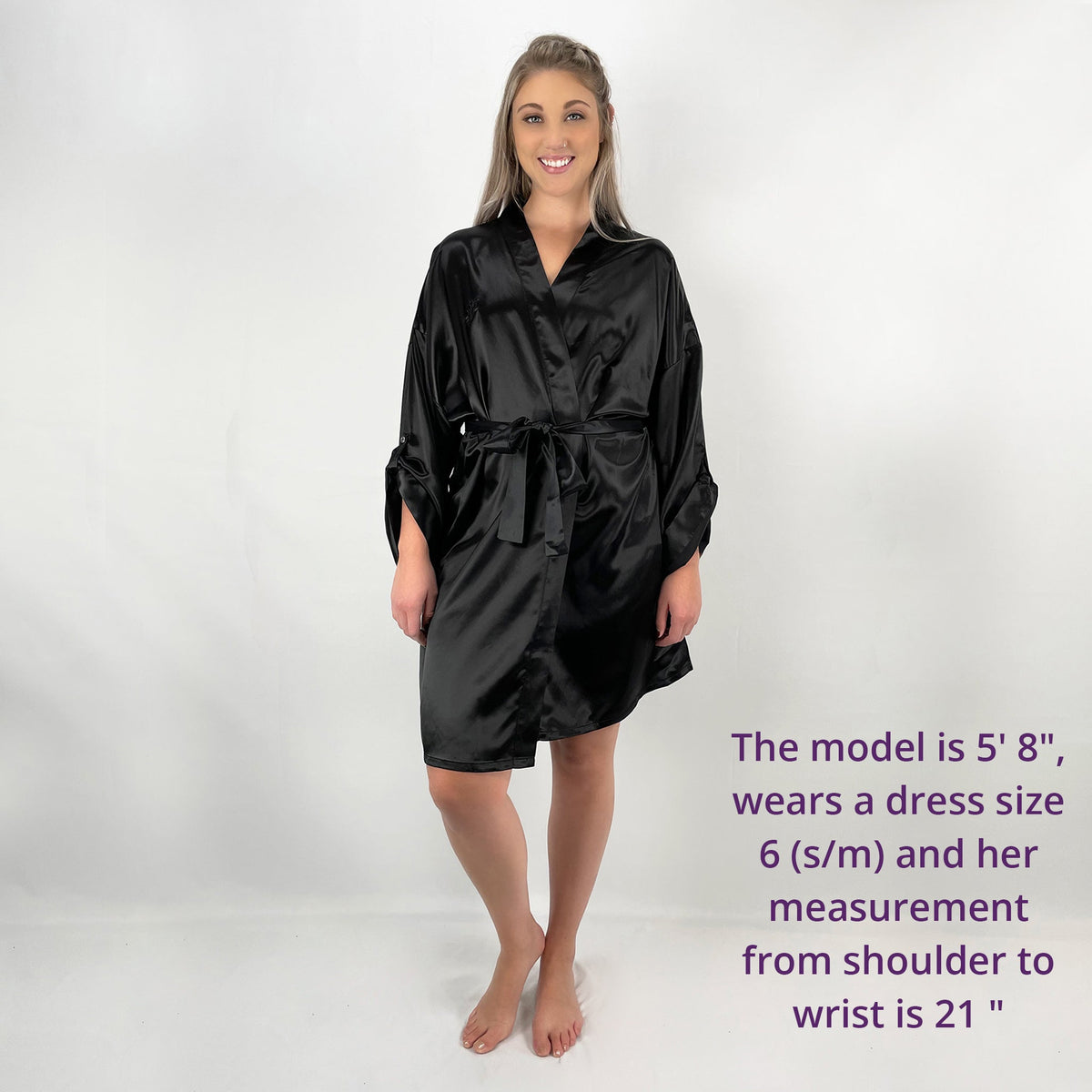 Woman standing in a front view, with measurements and size details of a luxury robes for women