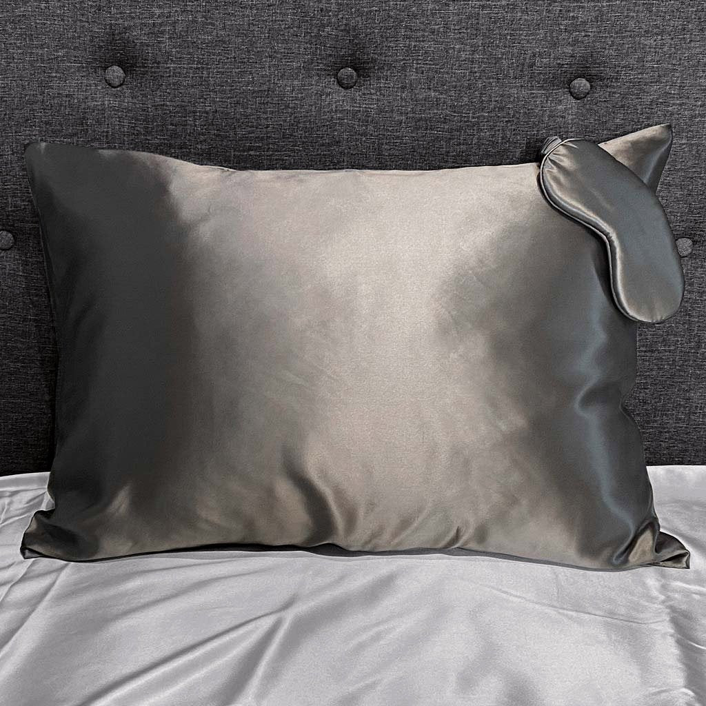 Gunmetal silk pillowcase with matching sleep mask, offering a smooth and luxurious