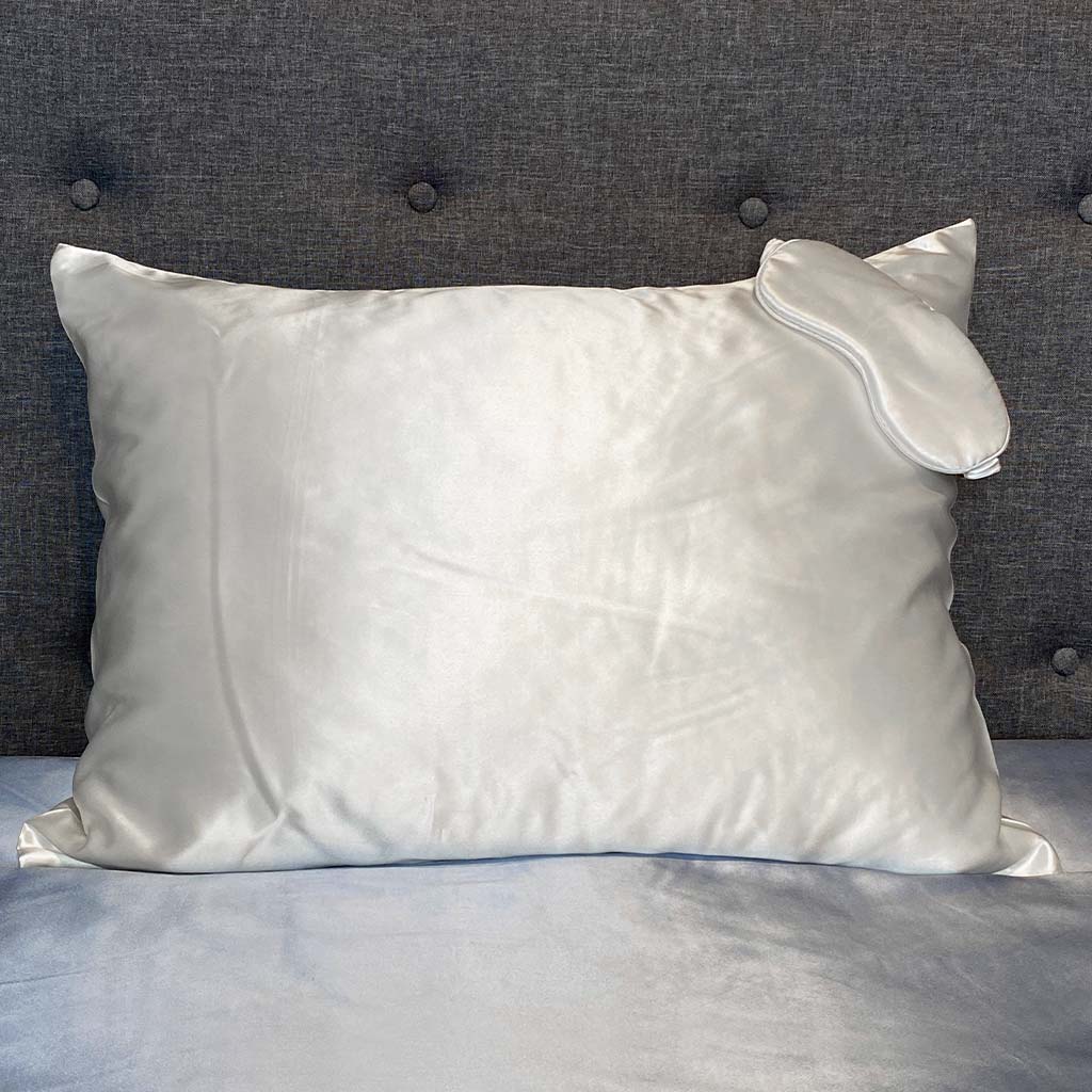 White silk pillowcase with matching sleep mask, offering a smooth and luxurious