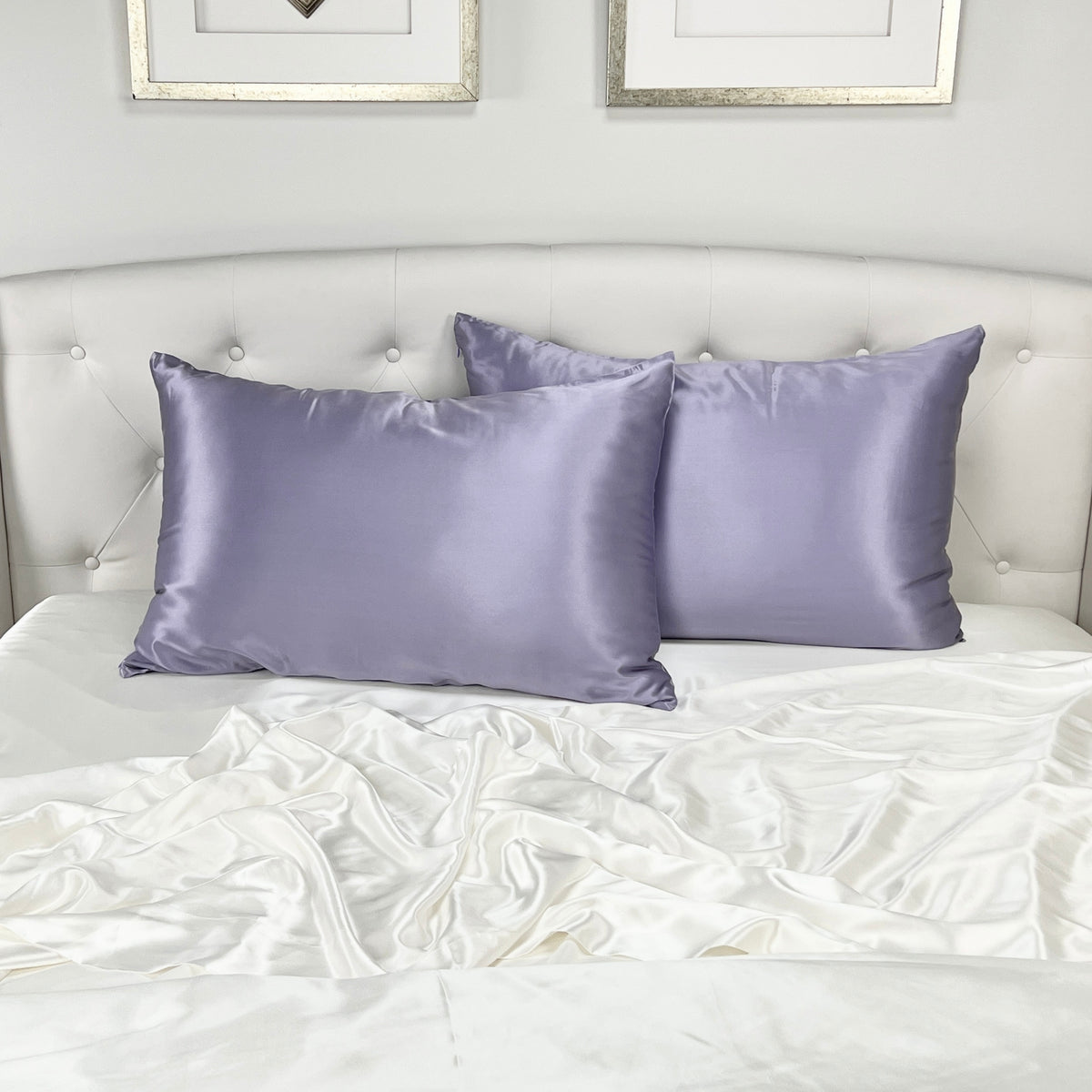 Lilac silk pillowcase with a smooth, glossy finish, placed on the headboard bed