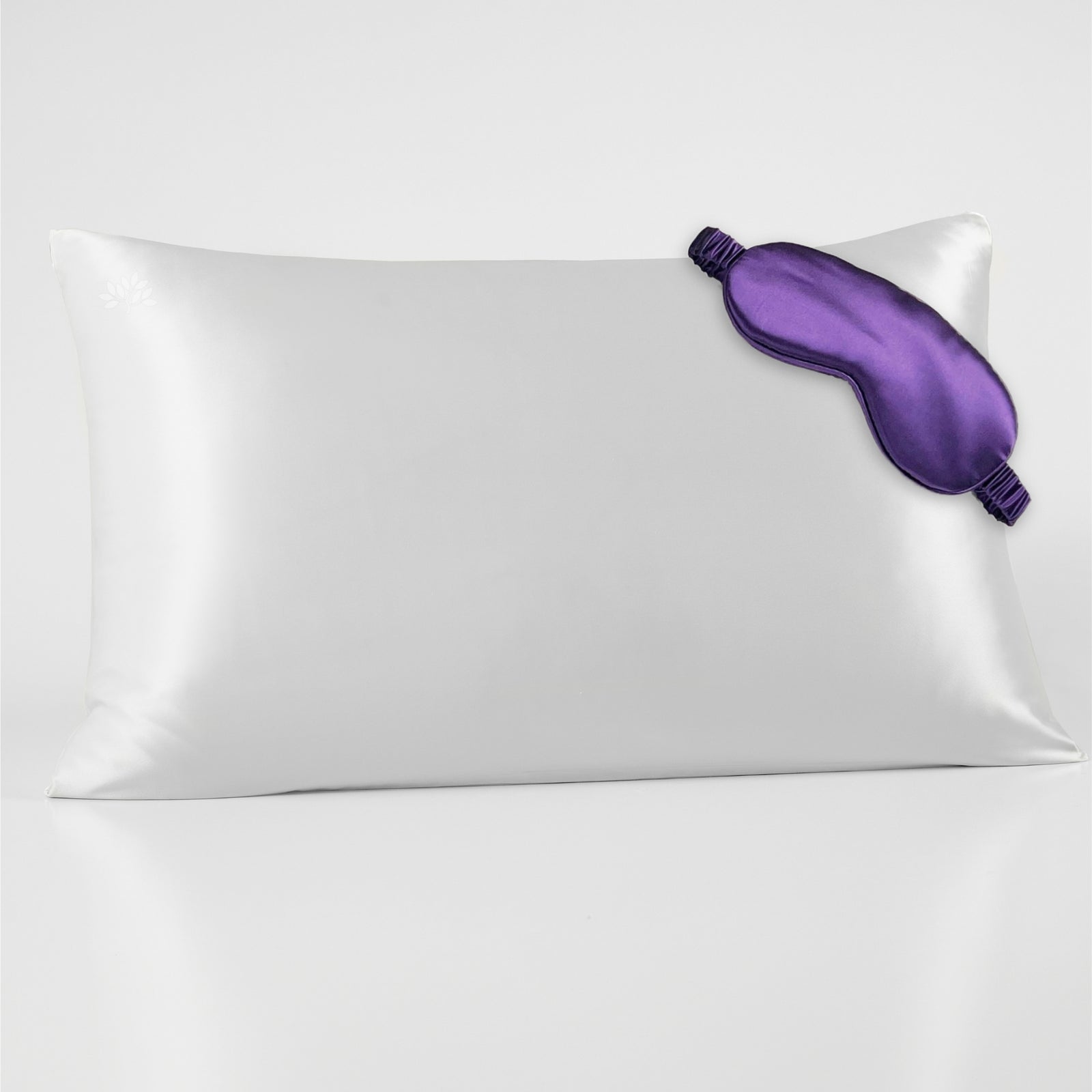 White silk pillowcase with matching sleep mask, offering a smooth and luxurious