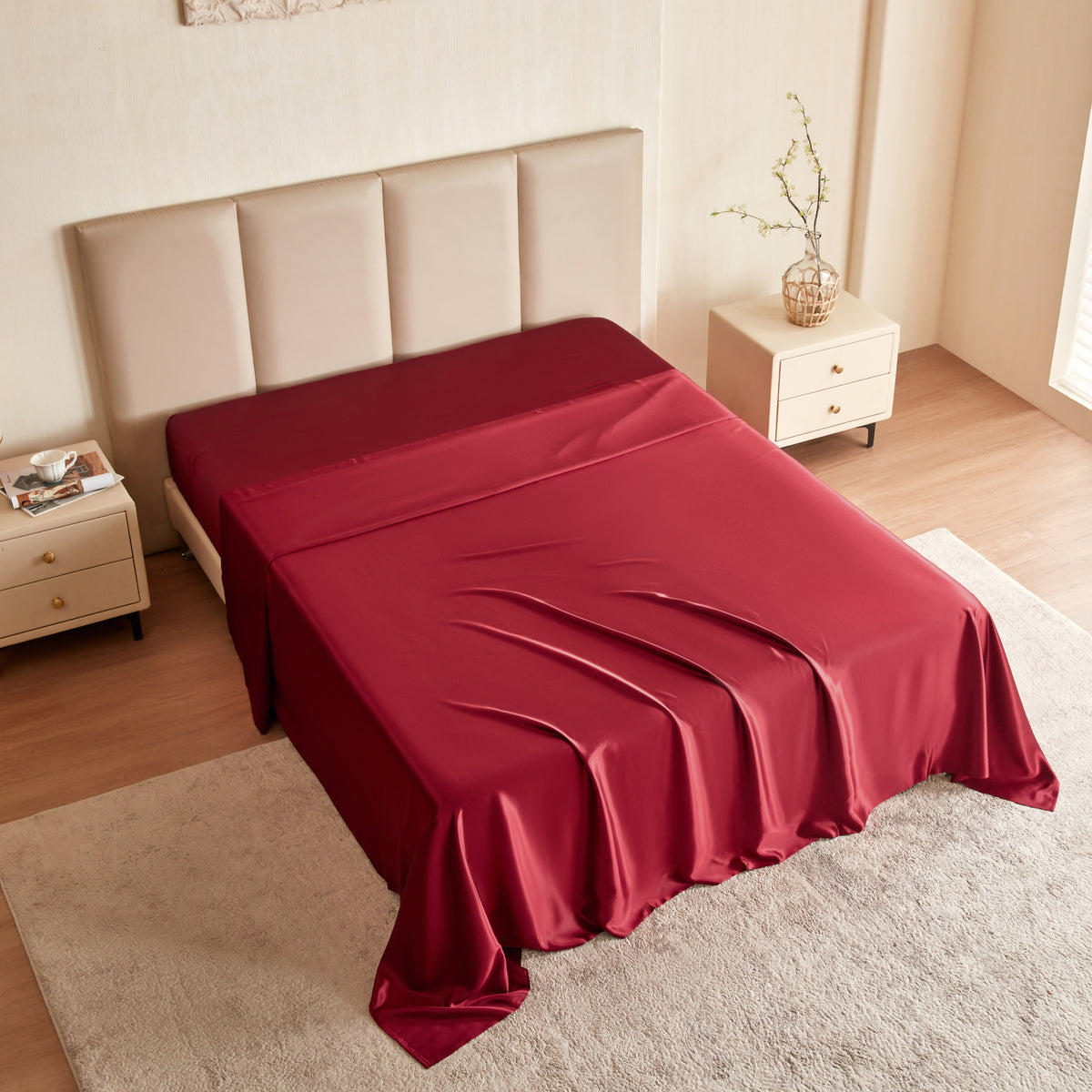 Red Silk sheet on a bed in a bedroom setting