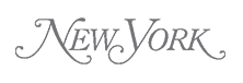 The words New York written in a stylized, elegant script font with silk-gray lettering on a light background.