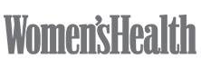 Womens Health magazine logo in bold, gray, serif font on a light, silk-inspired background.