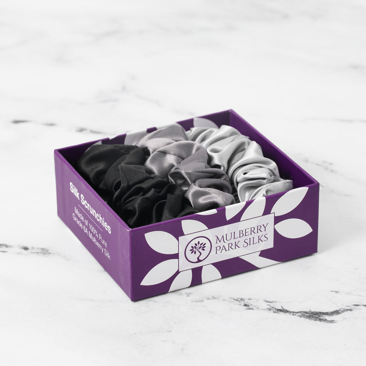 Mulberry Park Silks Silk Scrunchies - Midnight Black, Shimmery Silver, and Gunmetal Grey in Box on Marble